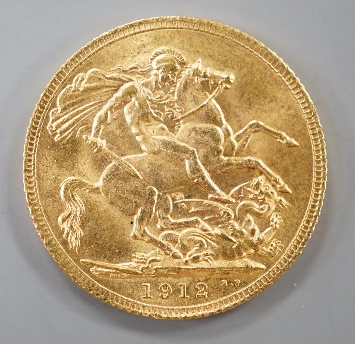 A George V 1912 gold sovereign.